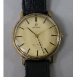 A gentleman's yellow metal Omega manual wind wrist watch.