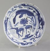 A Chinese late Ming kraak blue and white dish, Wanli period, the centre painted with two deer in a