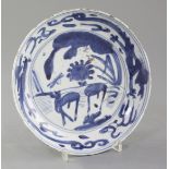 A Chinese late Ming kraak blue and white dish, Wanli period, the centre painted with two deer in a