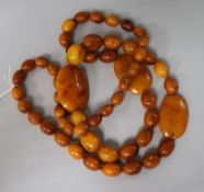 A single strand amber bead necklace, strung with oval and flat beads, gross weight, 109 grams, 98