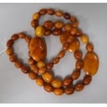 A single strand amber bead necklace, strung with oval and flat beads, gross weight, 109 grams, 98