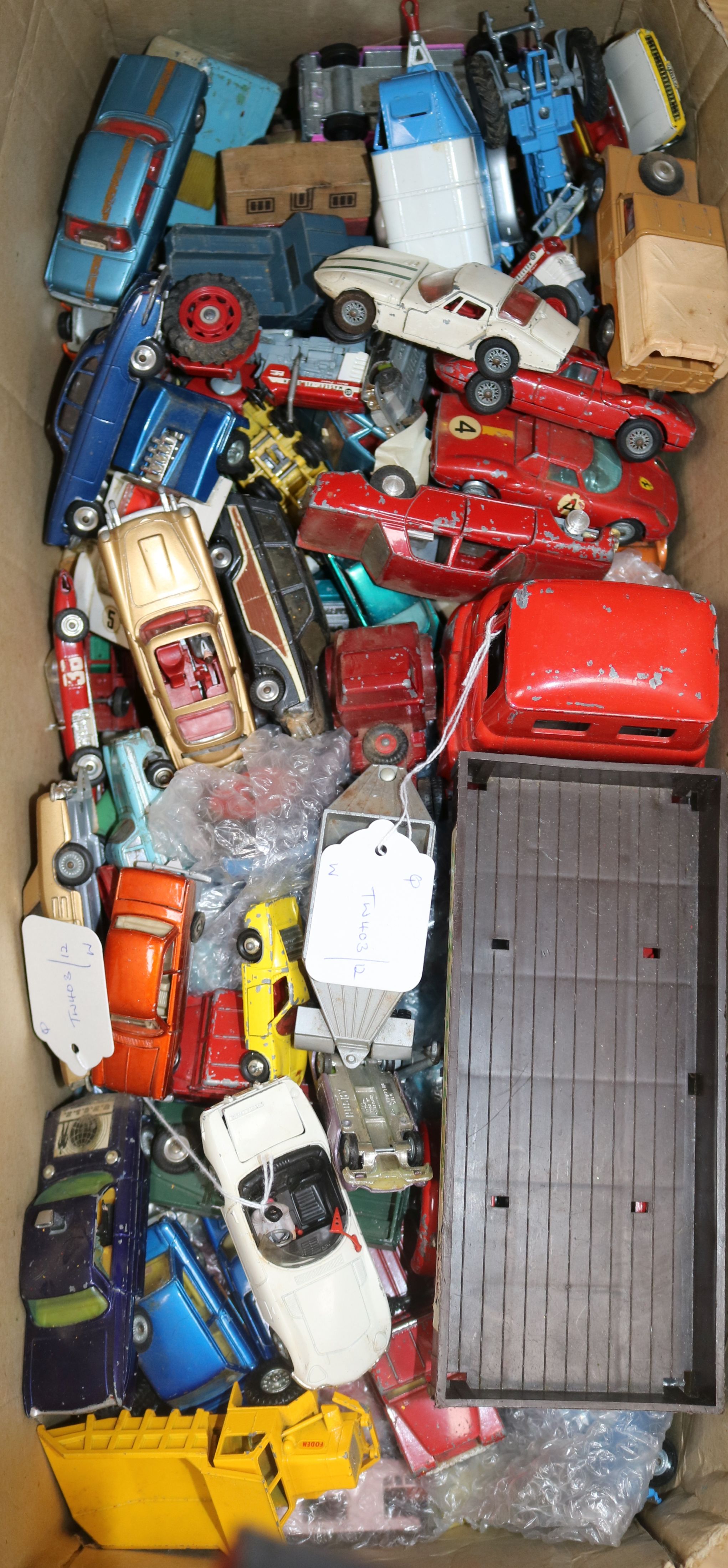 A Tri-ang tinplate flatbed truck and a quantity of unboxed diecast vehicles,