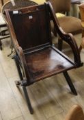 A carved oak church chair