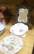 A brass framed mirror, a faience plate and a porcelain dish H.37cm