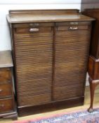 A 1920's oak filing cabinet W.93cm