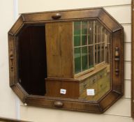A 1920's oak octagonal wall mirror W.75cm