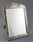 A George V silver mounted rectangular easel mirror by Frederick William Hentsch, with serpentine
