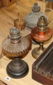 Three oil lamps and ship's lamp