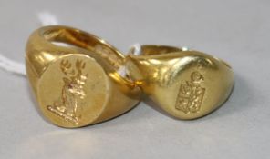 An 18ct gold signet ring and a similar yellow metal signet ring.