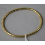 A Tiffany & Co 18ct gold bangle.