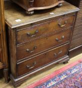 A small George III style mahogany chest, fitted three small drawers and a brushing slide W.75cm