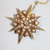 An Edwardian yellow metal, split pearl and diamond set starburst pendant brooch, 34mm.
