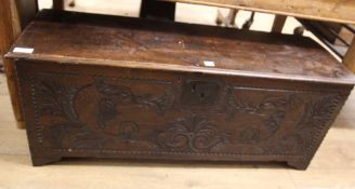 A later carved oak coffer W.117cm