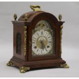 A walnut and brass mounted mantel clock 26cm.