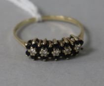 A 9ct gold, sapphire and diamond half hoop ring, size R.