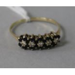 A 9ct gold, sapphire and diamond half hoop ring, size R.