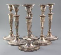 A set of six early 19th century Sheffield plated candlesticks, of oval for, with panelled tapering