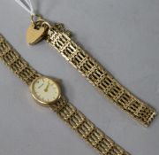 A 9ct gold wristwatch on gatelink bracelet, a similar bracelet with padlock clasp and a pair of
