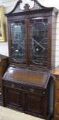 A 1920's blind fret carved mahogany bureau bookcase W.96cm