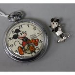 An Ingersoll Mickey Mouse pocket watch and badge.