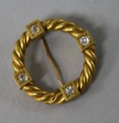 A yellow metal and diamond set ropetwist circular brooch, 26mm.