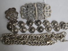 A late Victorian silver buckle, a silver brooch and two white metal necklaces.