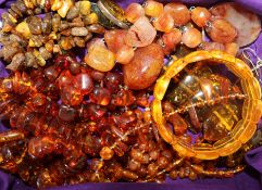 A collection of cornelian and amber coloured jewellery.