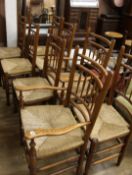 A set of 8 oak and ash spindle back rush seat chairs (6 + 2 carvers)