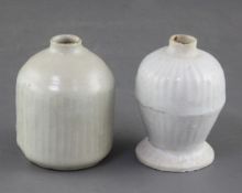 A Chinese Ding ware pot and a Qingbai pot, Song dynasty, the ovoid Ding ware pot incised with flutes