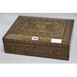 A Damascus style brass and abalone inlaid box 36 x 11cm