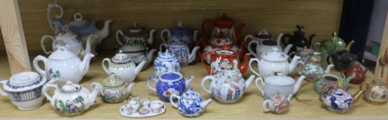 A large collection of ceramic teapots including German, Staffordshire, Cantonese, etc.