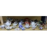 A large collection of ceramic teapots including German, Staffordshire, Cantonese, etc.