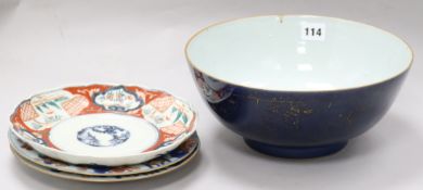 A Chinese gilt decorated powder blue bowl and two Chinese Imari plates, 18th century and a