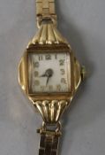 A lady's 9ct gold manual wind wrist watch on a 9ct gold bracelet.