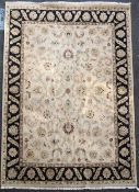 A Tabriz style carpet, with field of palmette scrolls on a beige ground, 12ft 2in. x 9ft 1in.