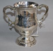 A George III silver two handled pedestal presentation cup with inscription relating to Trinity