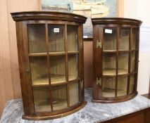 A pair of hanging corner cabinets W.50cm