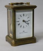 A gilt-brass carriage timepiece with white enamelled Roman dial 12cm.