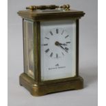 A gilt-brass carriage timepiece with white enamelled Roman dial 12cm.