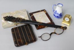 A group of curios including two card cases, cigarette case, and lorgnettes
