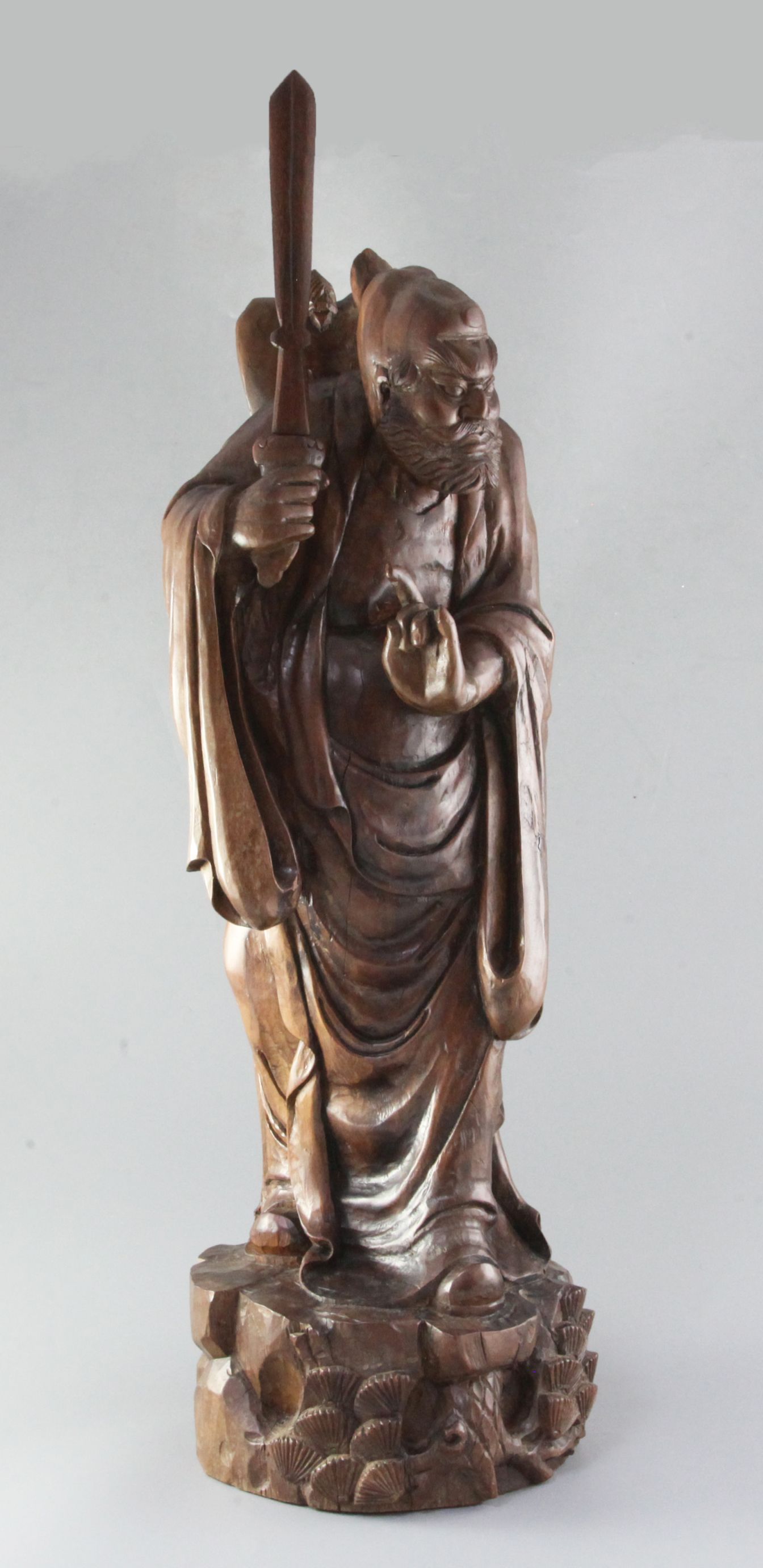 A large Chinese hardwood figure of Lu Dongbin, late 19th/early 20th century, height 71cm,