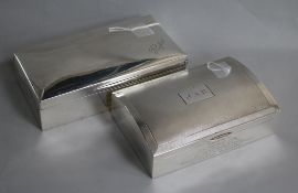 Two large silver cigarette boxes, variously inscribed, one engine-turned