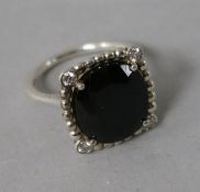 A Tiffany & Co silver, black stone and diamond dress ring, size J.