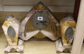 An art deco 3 piece rouge marble clock garniture H.29cm