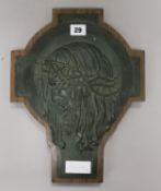 A bronze plaque of Christ on modern base H.36cm