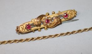 An Edwardian 15ct gold and gem set bar brooch and a 9ct gold bracelet (a.f.).