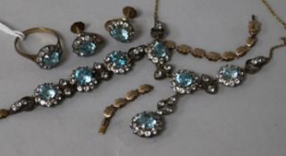 An early 20th century yellow and white metal, blue zircon and white stone parure and a similar