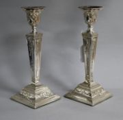 A pair of 1970's silver candlesticks with ram's head and harebell decoration, D.J. Silver Repairs,