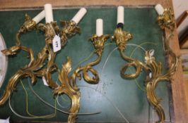 A set of three gilt brass twin branch wall lights, recently re-wired height 39cm