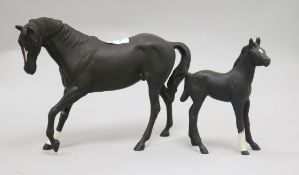 A Royal Doulton mare and foal largest 18cm.From the estate of the late Sheila Farebrother.